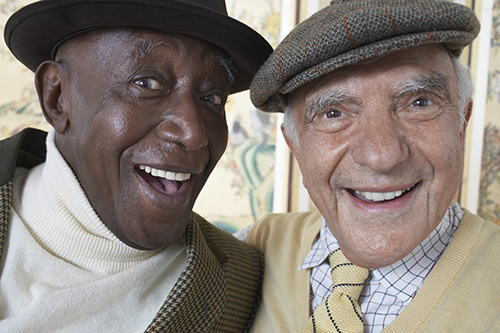 Elderly couple sitting in dining area having a cup of coffee